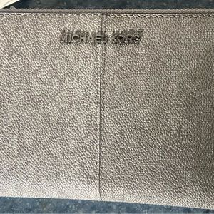 Michael kors gray wallet with tags , retails for $76